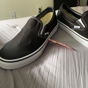 Black slip on Vans, never worn